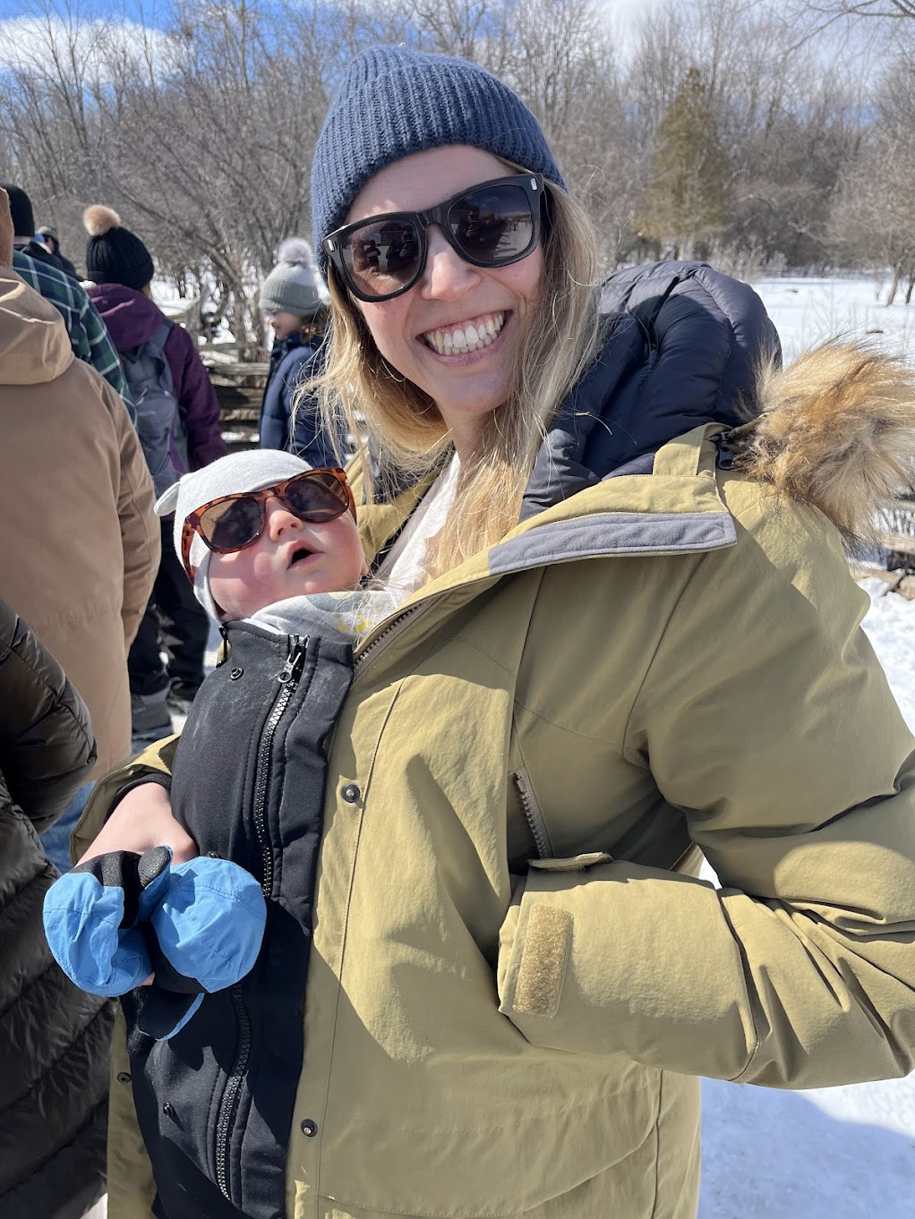Your coach with her baby outdoors in winter